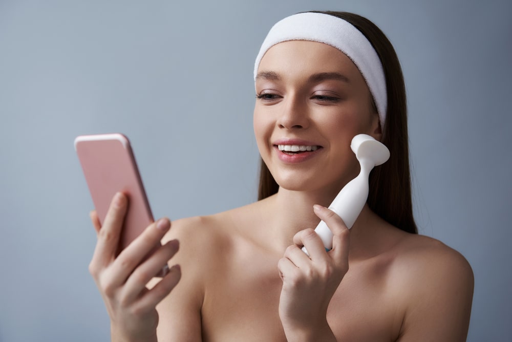 young-lady-using-pore-cleansing-brush